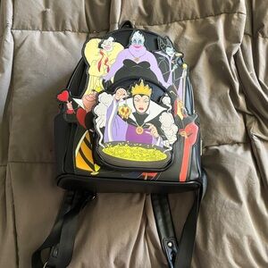 Loungefly Black Mini Backpack with Colorful Disney Villains Art glow in the dark